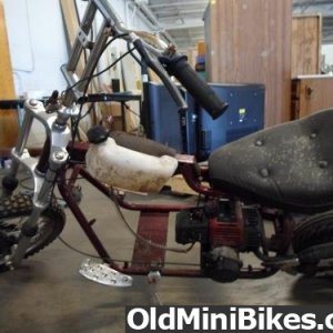 Here is the un-restored version of the blue mini  bike