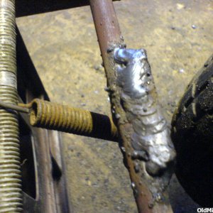 Scrub brake spring and arc welds